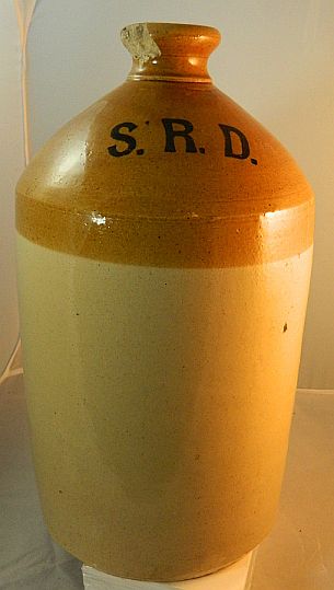 1900-1940s brnir demijohn jar with wicker removed showing the initials S.R.D.